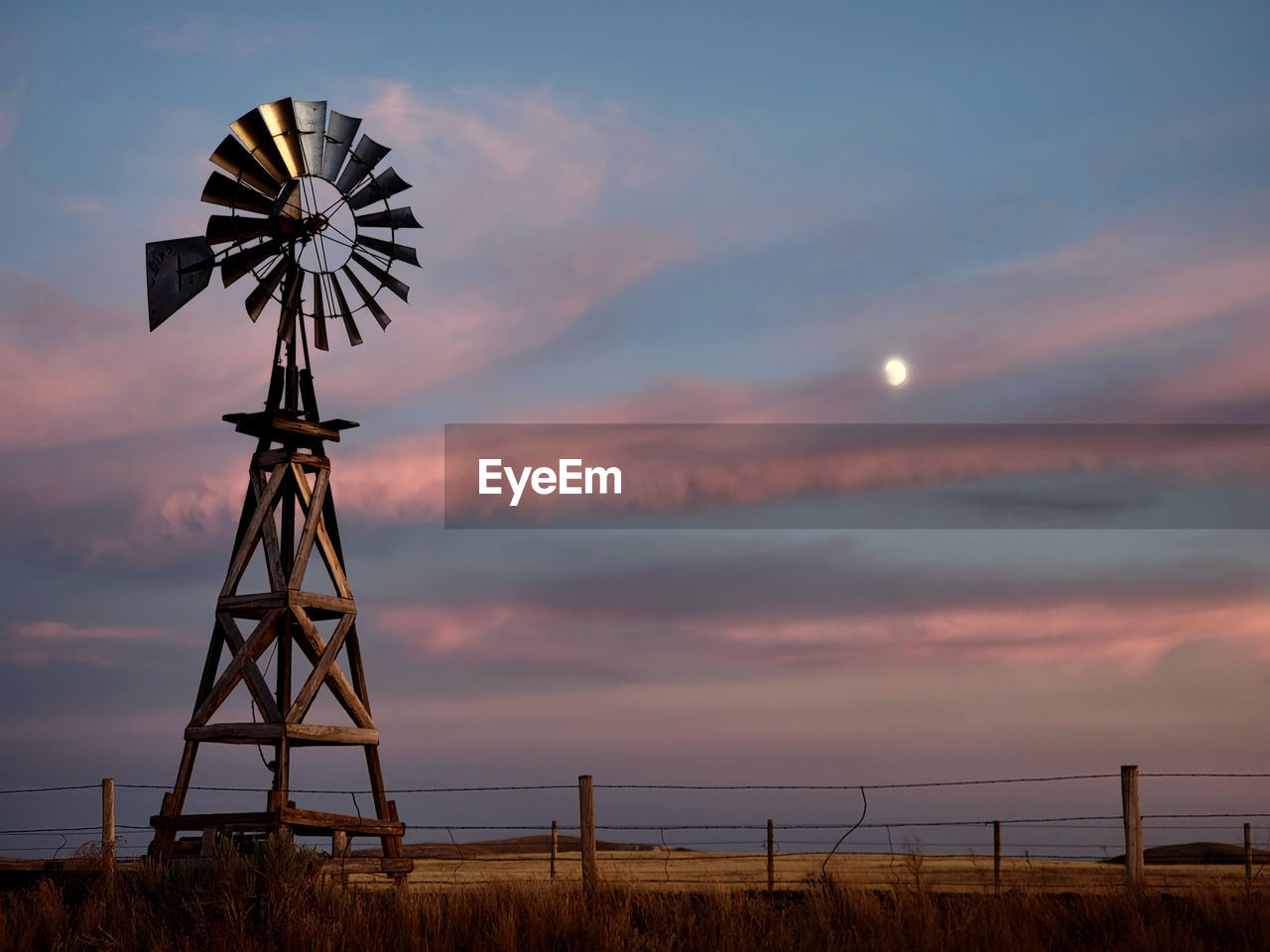 low angle view of windmill against sky