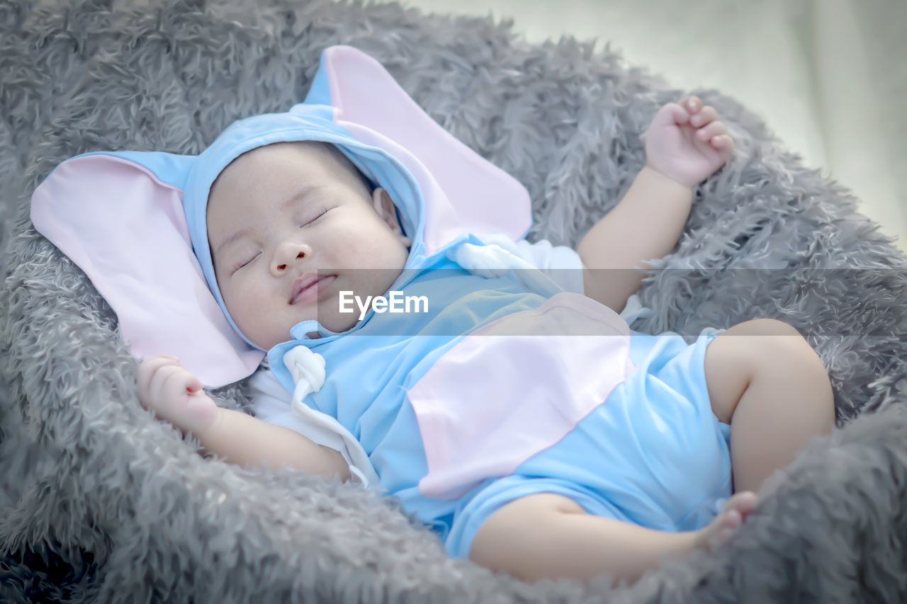 Portrait of cute girl sleeping on bed