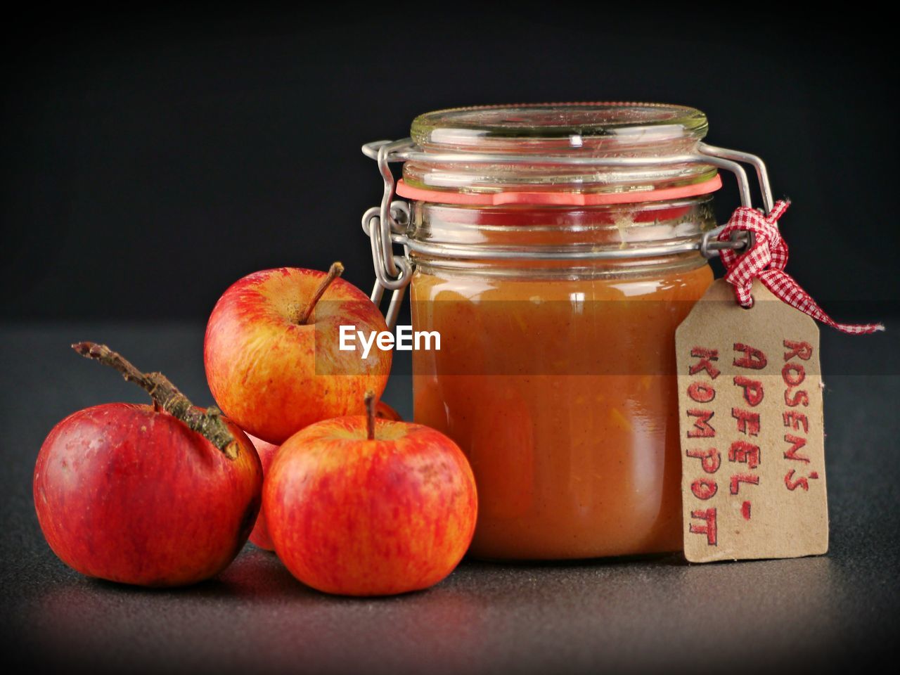 CLOSE-UP OF APPLES IN JAR