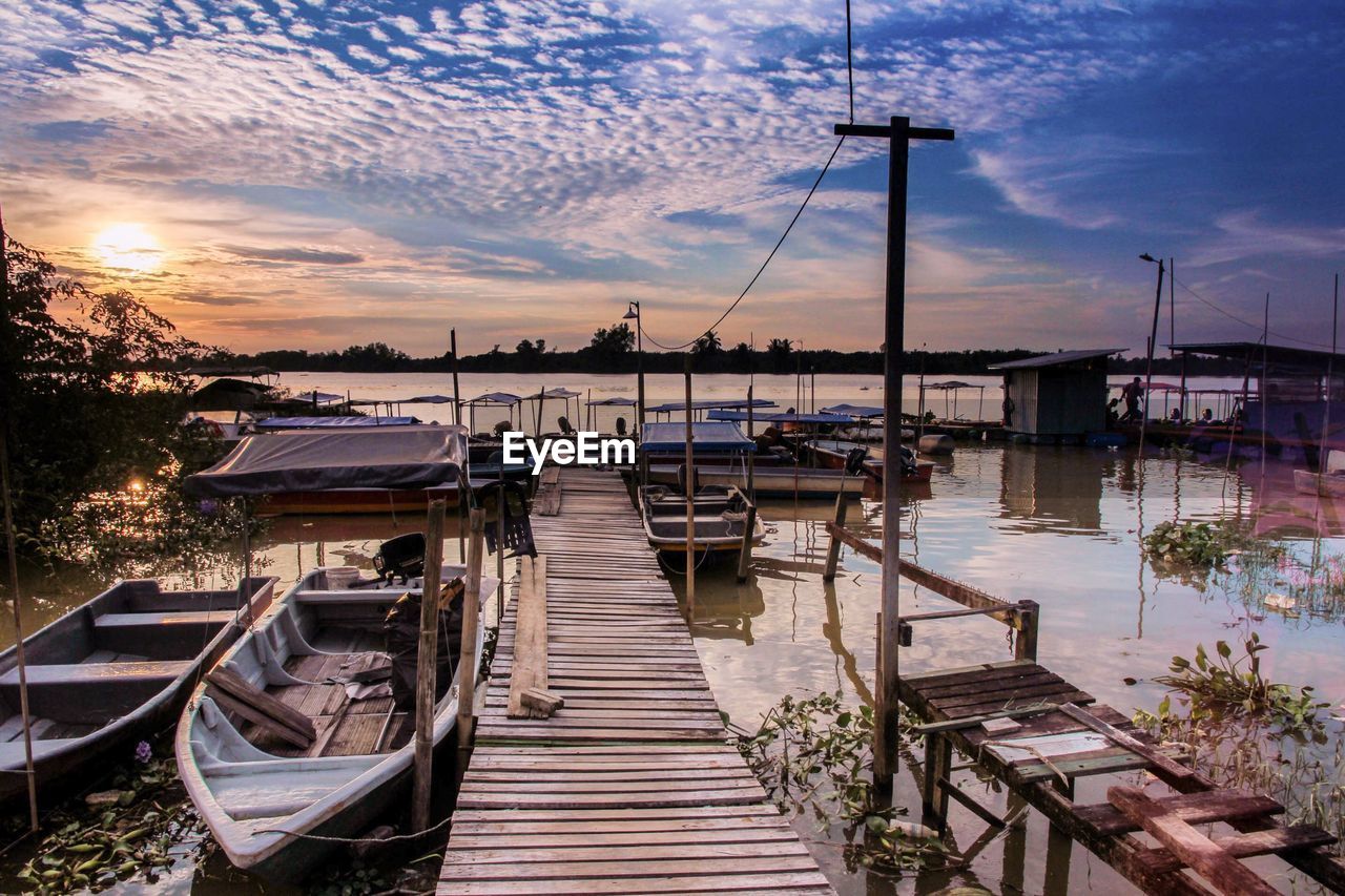 Boats moored at harbor