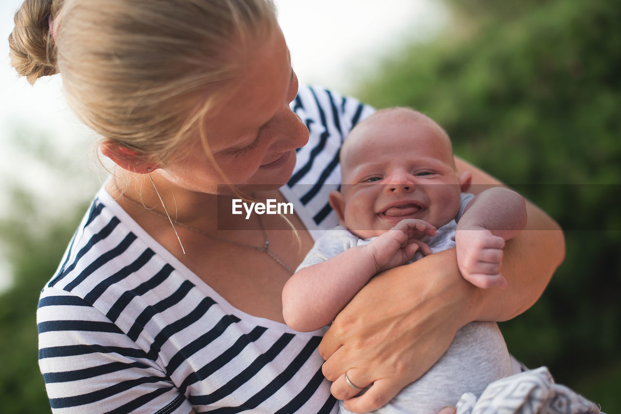 Close-up of mother holding baby boy