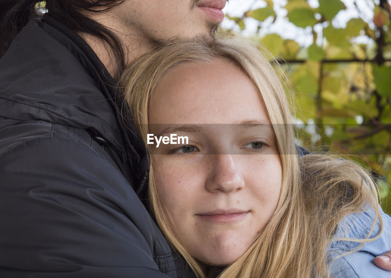 Close-up of young couple embracing