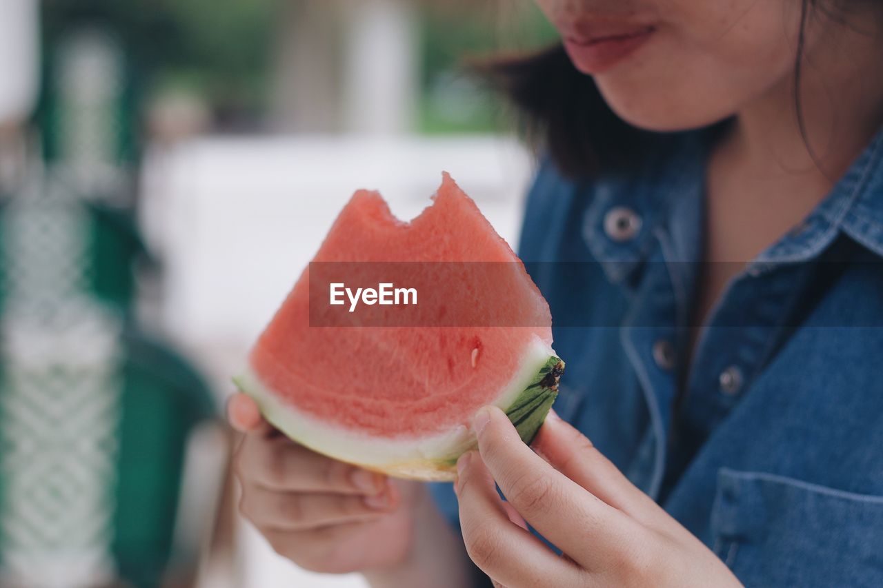 Woman eating watermelon