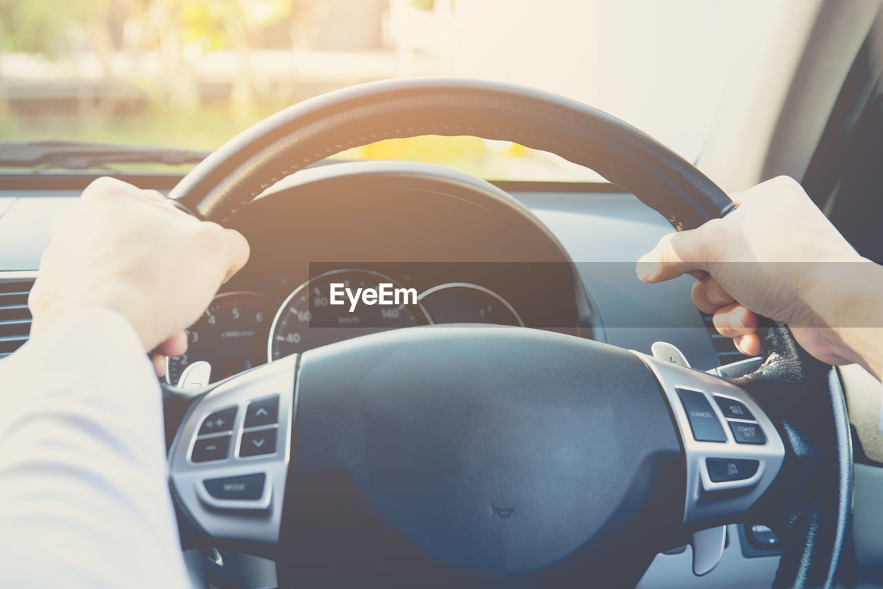 Close up portrait of  male driving car from rear view ,vintage filter,transport concept.