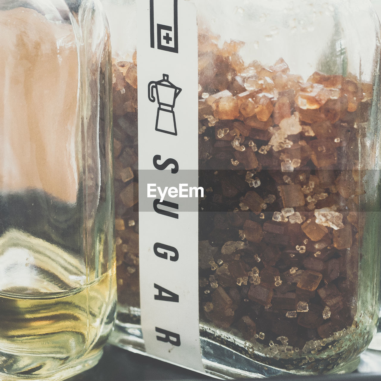 Close-up of brown sugar crystals in bottle