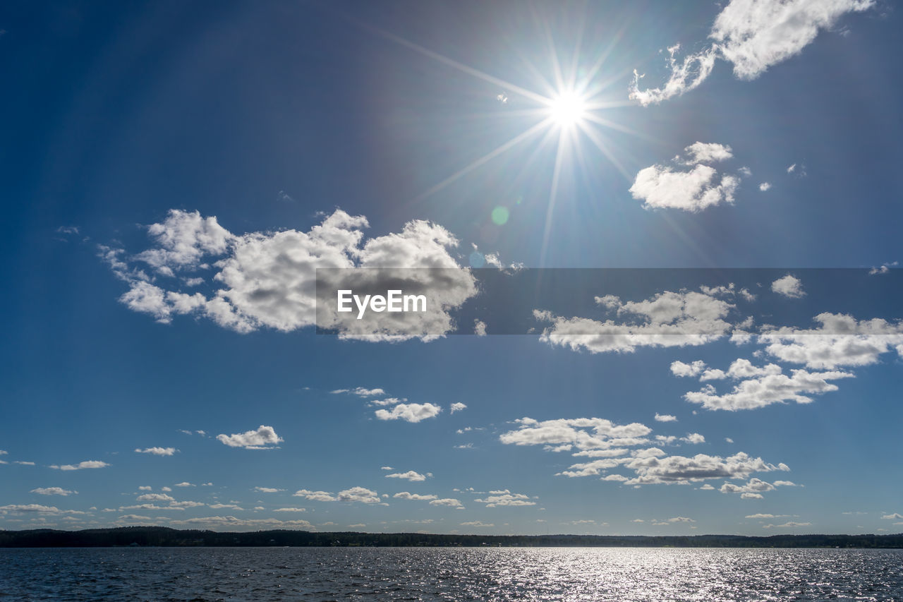 Scenic view of sea against sky on sunny day