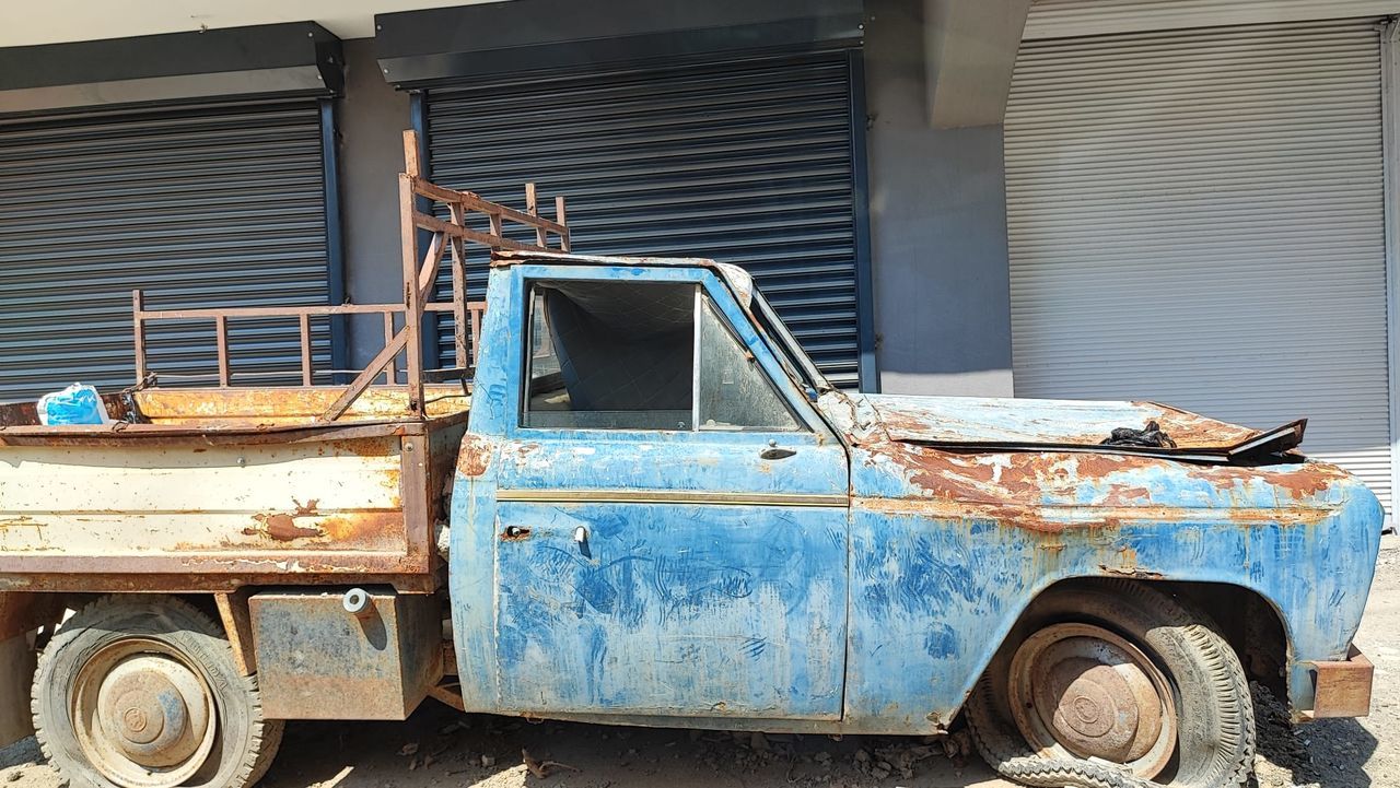 mode of transportation, transportation, car, vehicle, truck, motor vehicle, land vehicle, old, abandoned, antique car, architecture, rusty, metal, pickup truck, retro styled, rundown, day, damaged, no people, built structure, vintage car, building exterior, weathered, wheel, decline, deterioration, outdoors