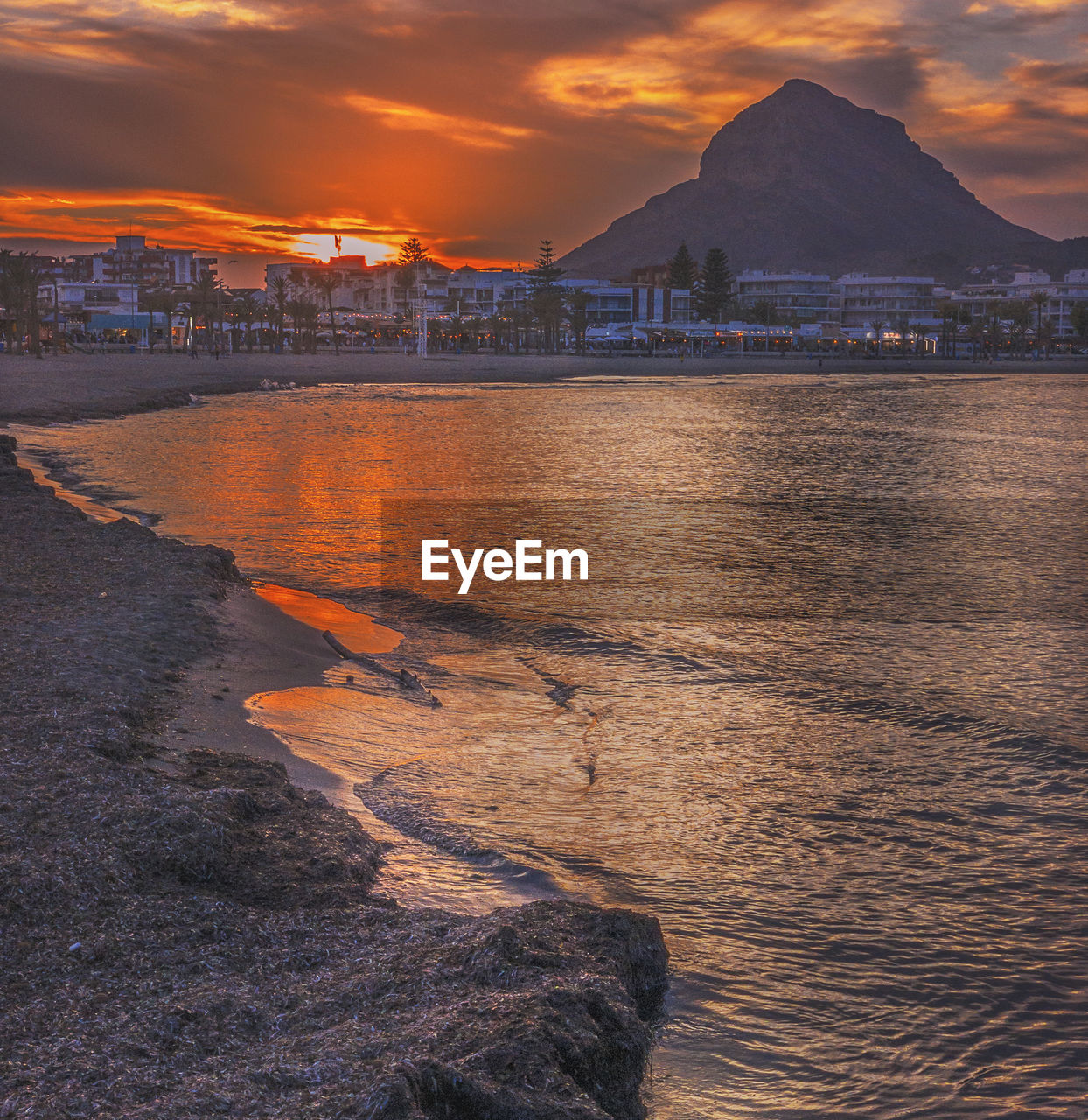 Sunset over the arenal bay, javea, alicante, spain,