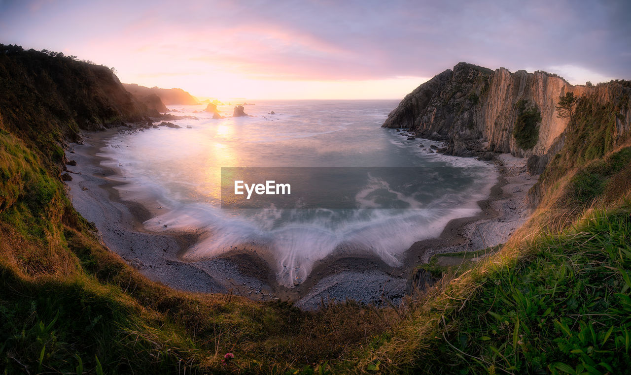 Scenic view of sea against sky during sunset