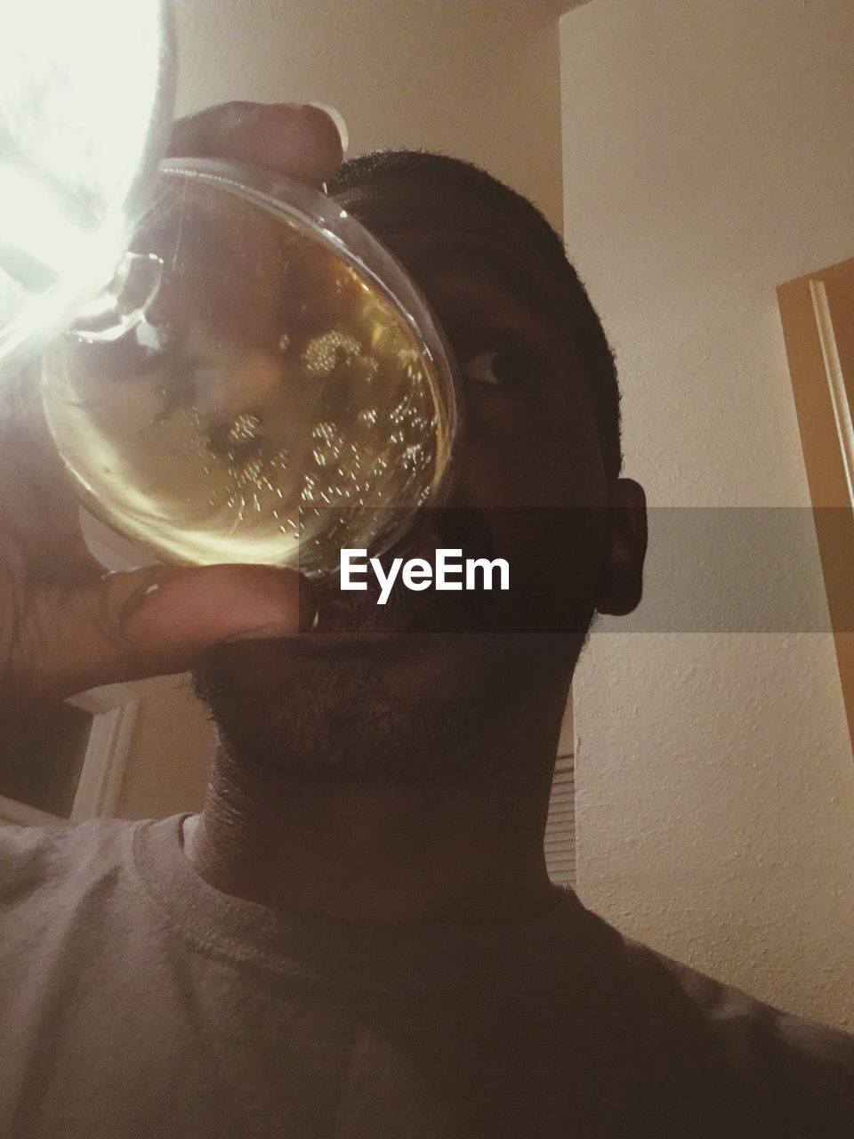 Low angle view of man drinking wine