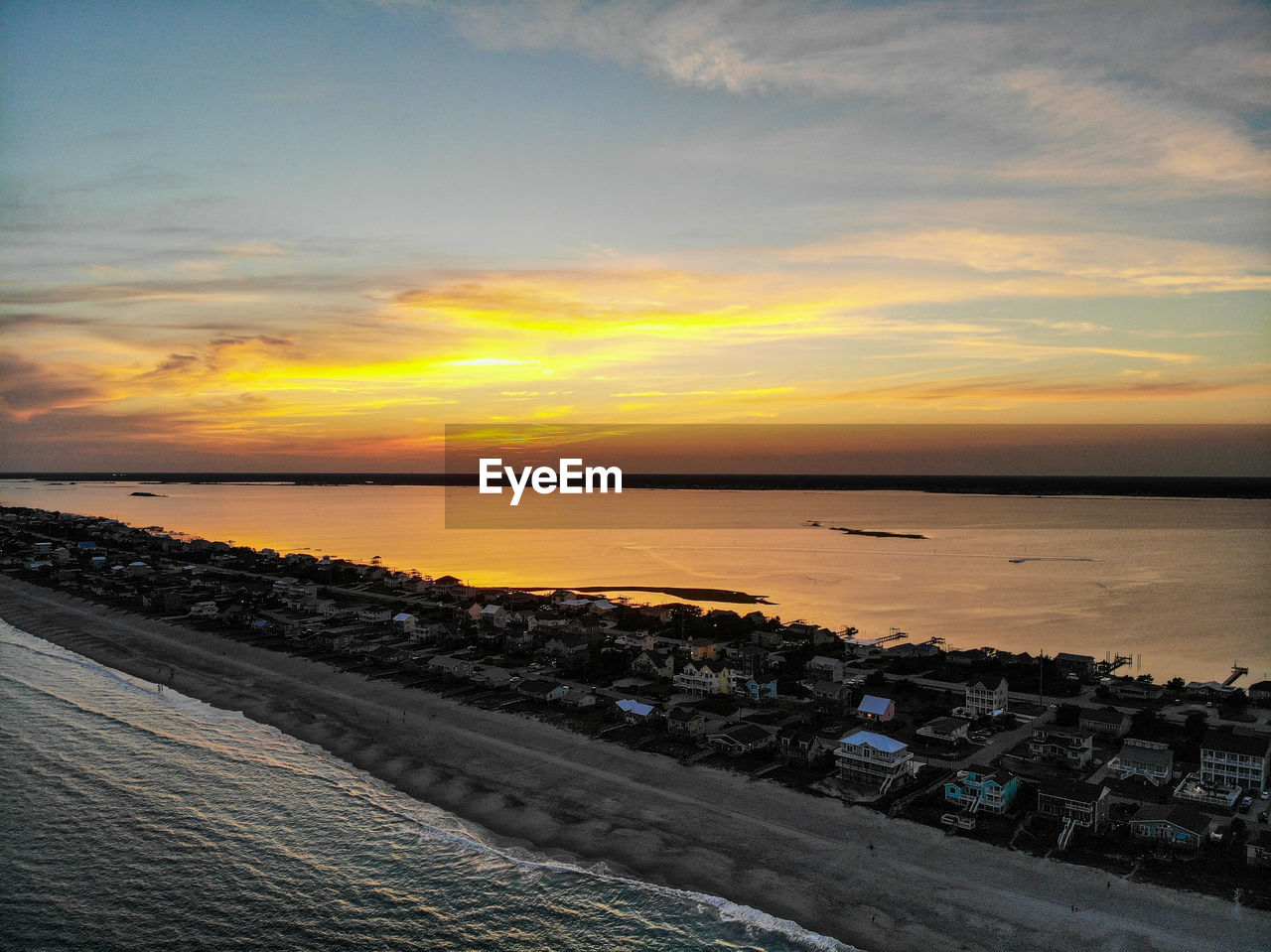 SCENIC VIEW OF SEA AGAINST ORANGE SKY
