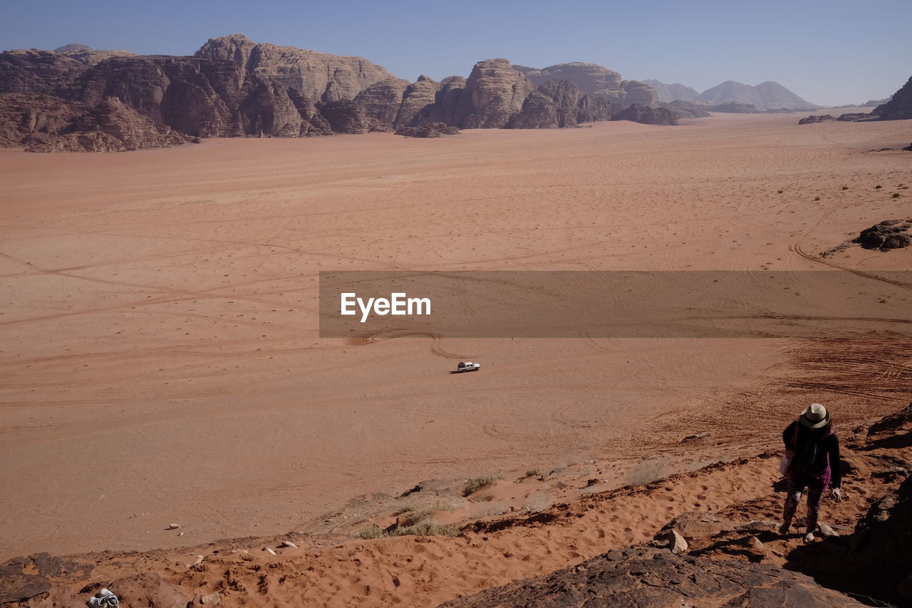 Woman walking in desert