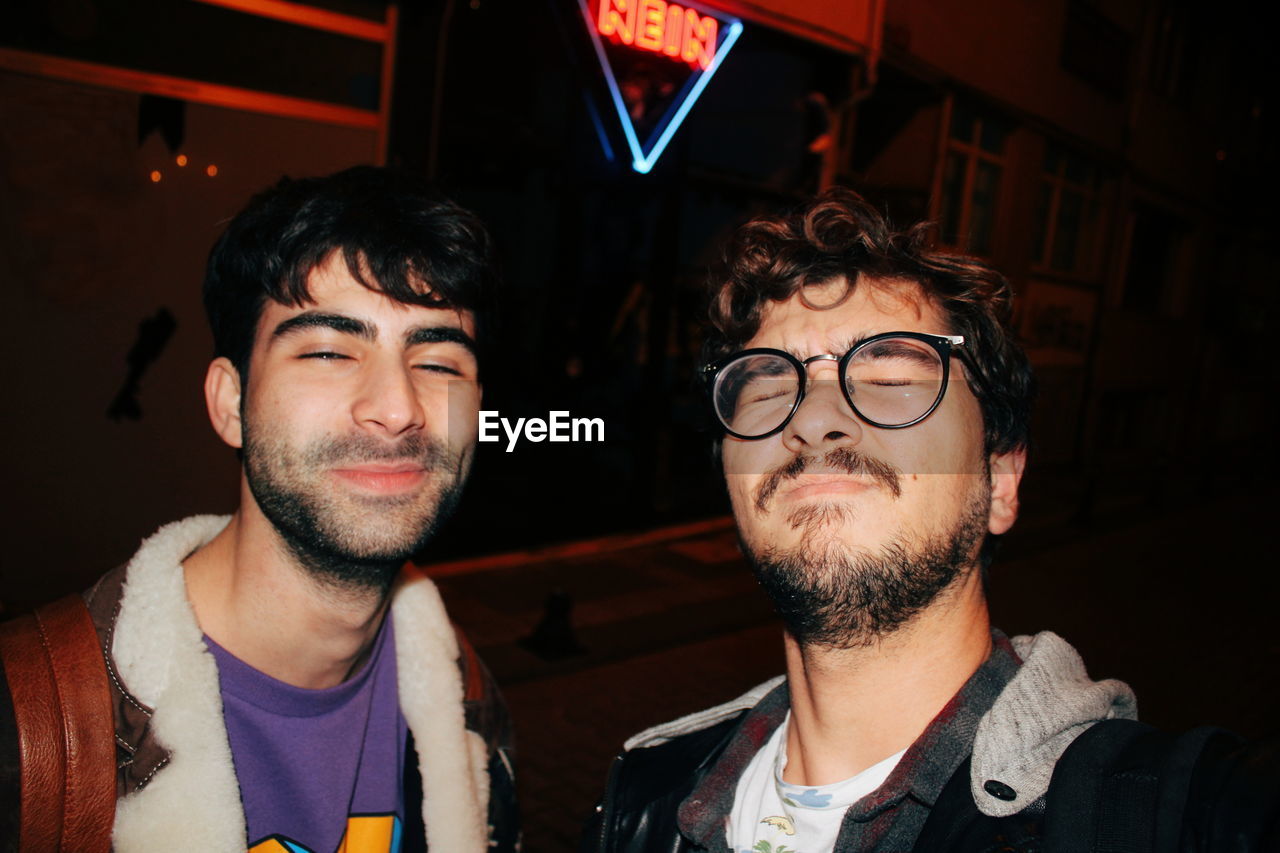 Close-up of male friends in nightclub