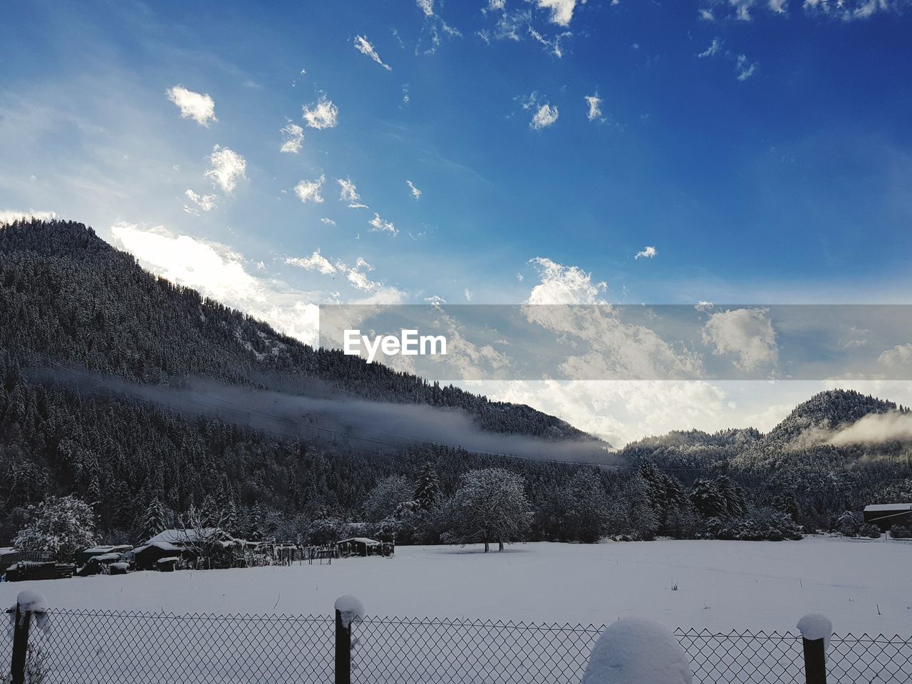 SCENIC VIEW OF LAKE AGAINST SKY DURING WINTER