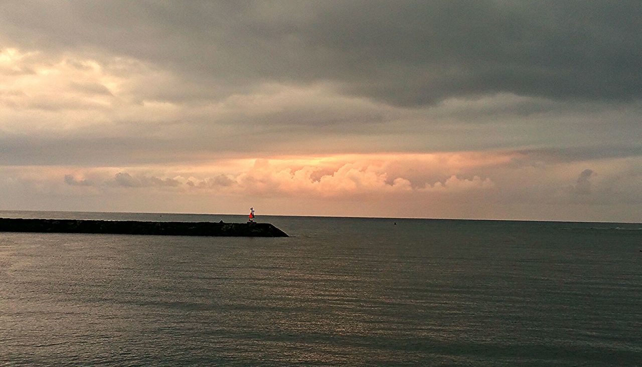 SCENIC VIEW OF SEA AT SUNSET