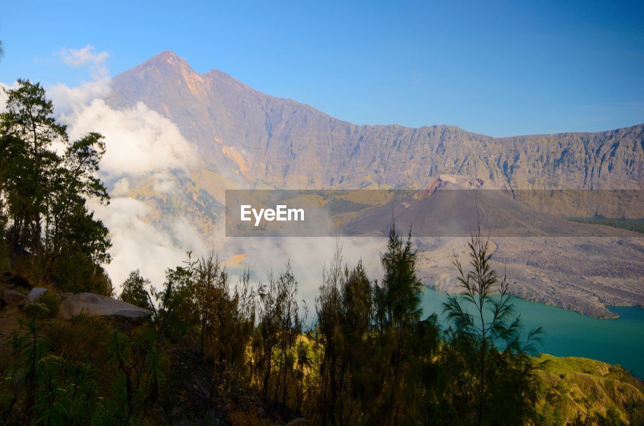 Panoramic view of volcanic mountains against sky