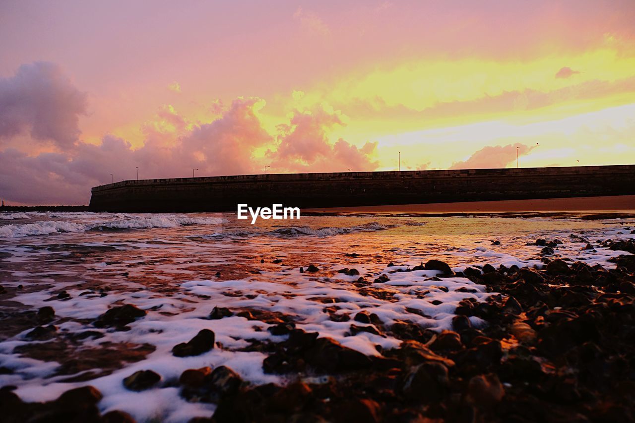 SCENIC VIEW OF SEA AGAINST ROMANTIC SKY