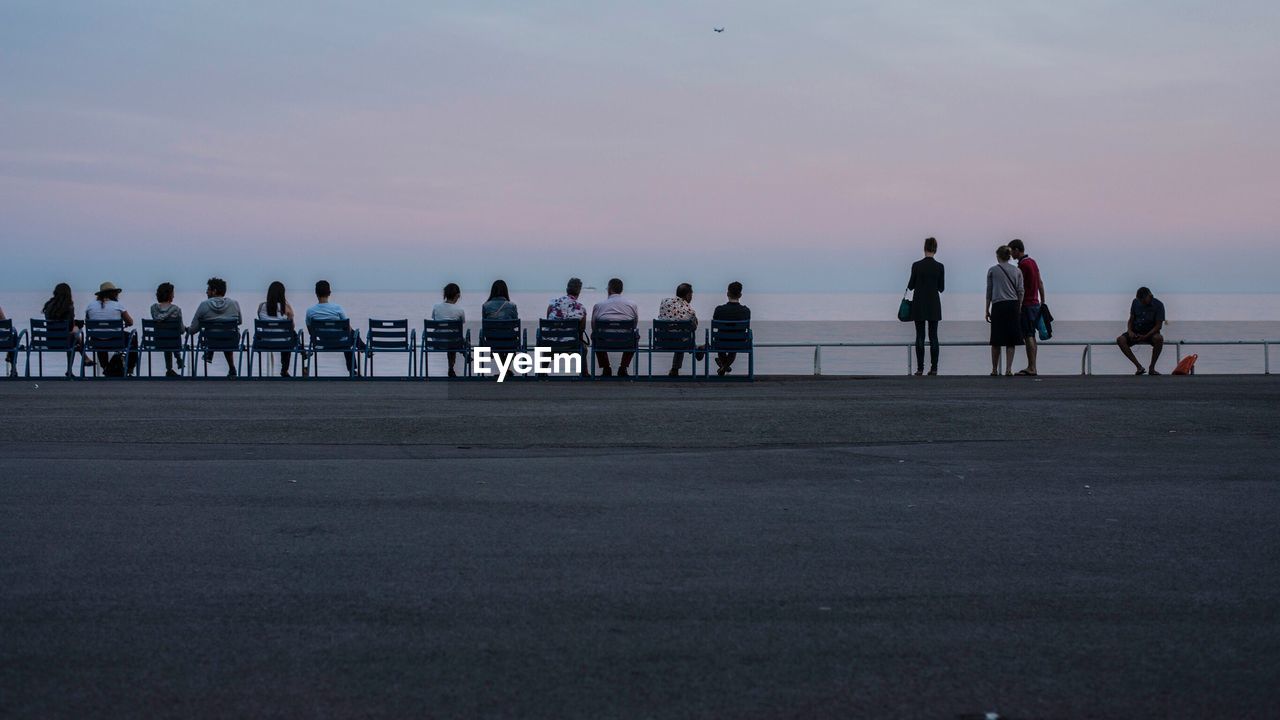 PEOPLE AT BEACH DURING SUNSET