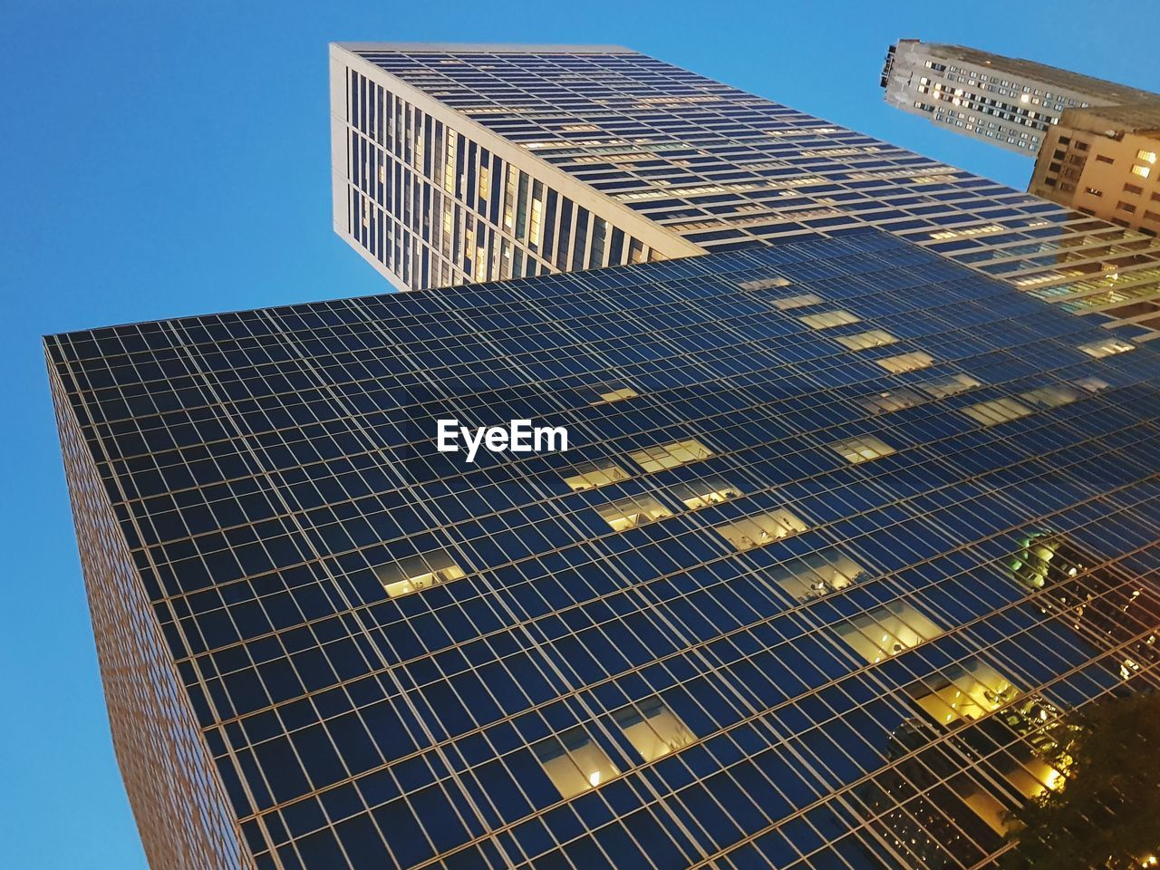 LOW ANGLE VIEW OF OFFICE BUILDING AGAINST SKY