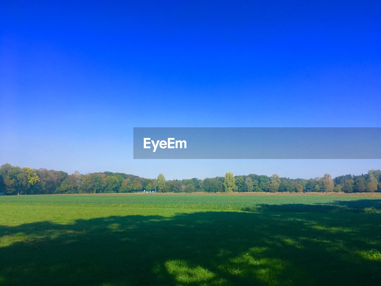 SCENIC VIEW OF LAND AGAINST CLEAR BLUE SKY