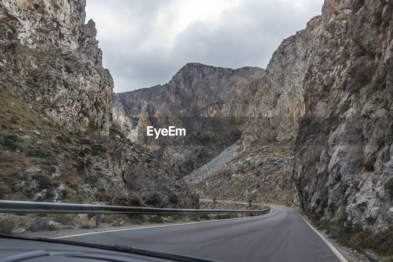 ROAD PASSING THROUGH MOUNTAINS