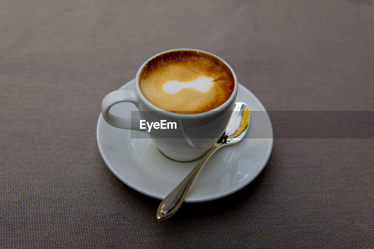 High angle view of coffee in cup on table