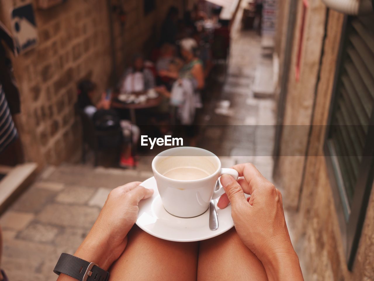Close-up of woman holding coffee cup
