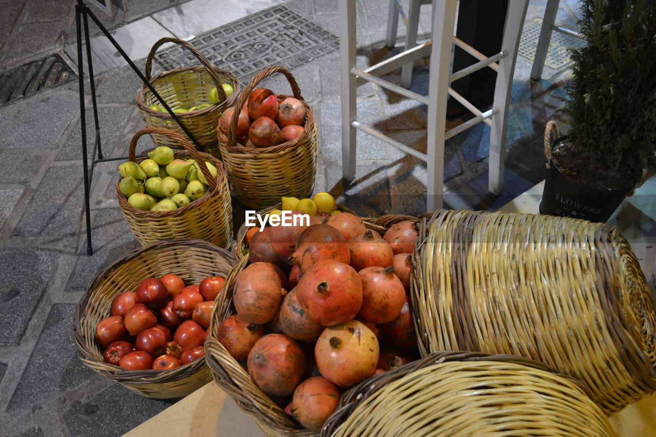 High angle view of fruits in wicker baskets at market