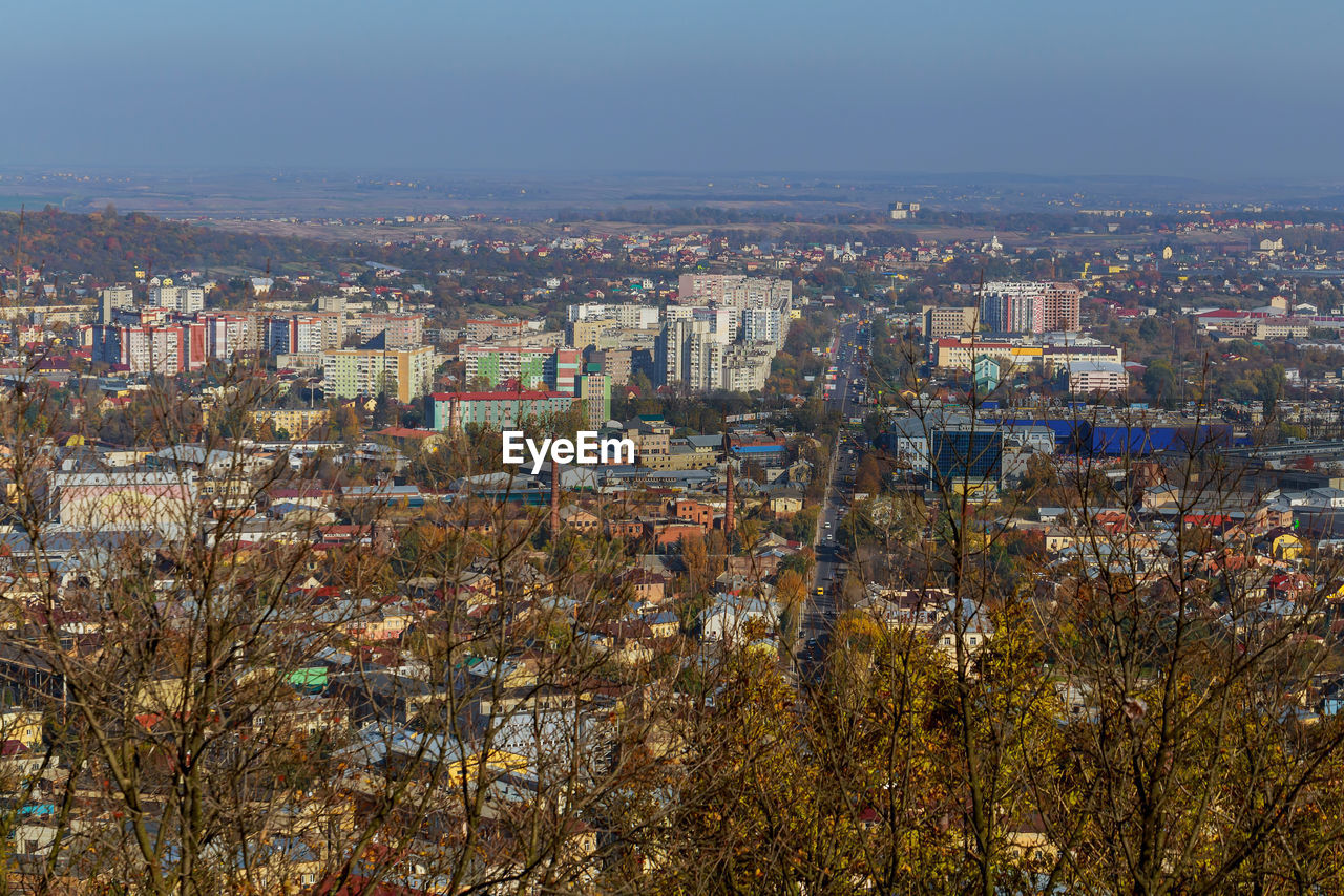 High angle view of buildings in city against sky