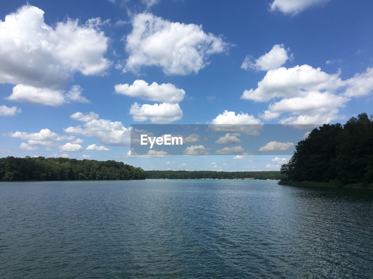 water, sky, cloud, scenics - nature, tree, body of water, beauty in nature, nature, reservoir, lake, tranquility, tranquil scene, environment, plant, no people, blue, landscape, land, travel destinations, travel, day, forest, outdoors, non-urban scene, tourism, reflection, idyllic, trip, holiday, vacation, summer, shore, beach, island