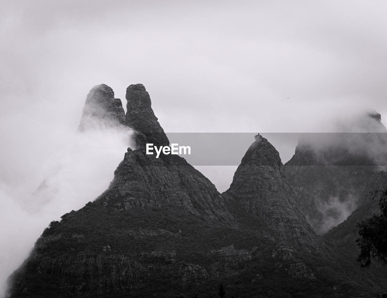 mountain, rock, sky, black and white, cloud, fog, scenics - nature, environment, beauty in nature, monochrome, landscape, nature, monochrome photography, mountain range, mountain peak, travel destinations, land, travel, no people, outdoors, summit, rock formation, non-urban scene, snow, tranquility, darkness, tourism, geology, white, activity, black