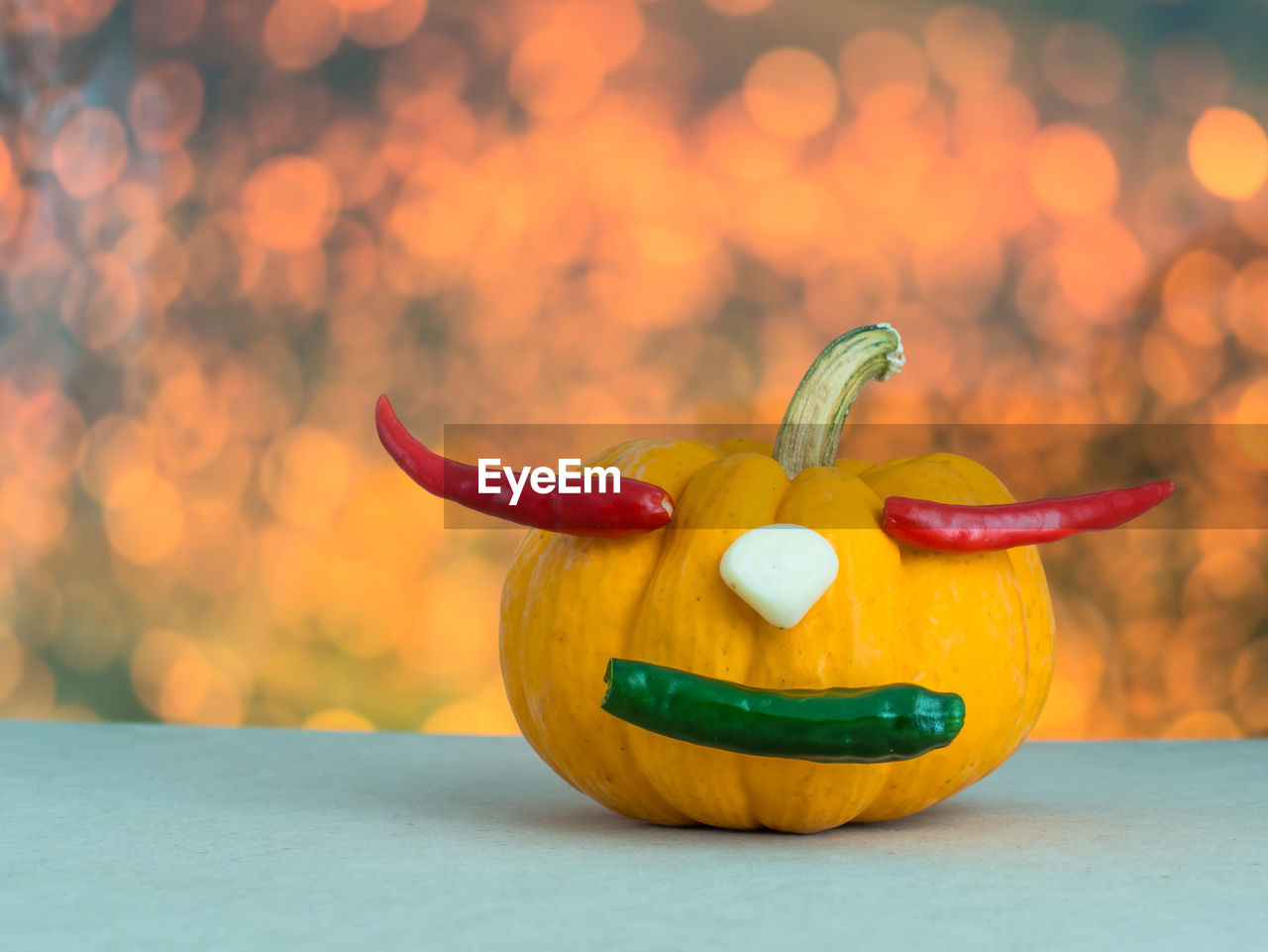 CLOSE-UP OF YELLOW CHILI PEPPER ON TABLE