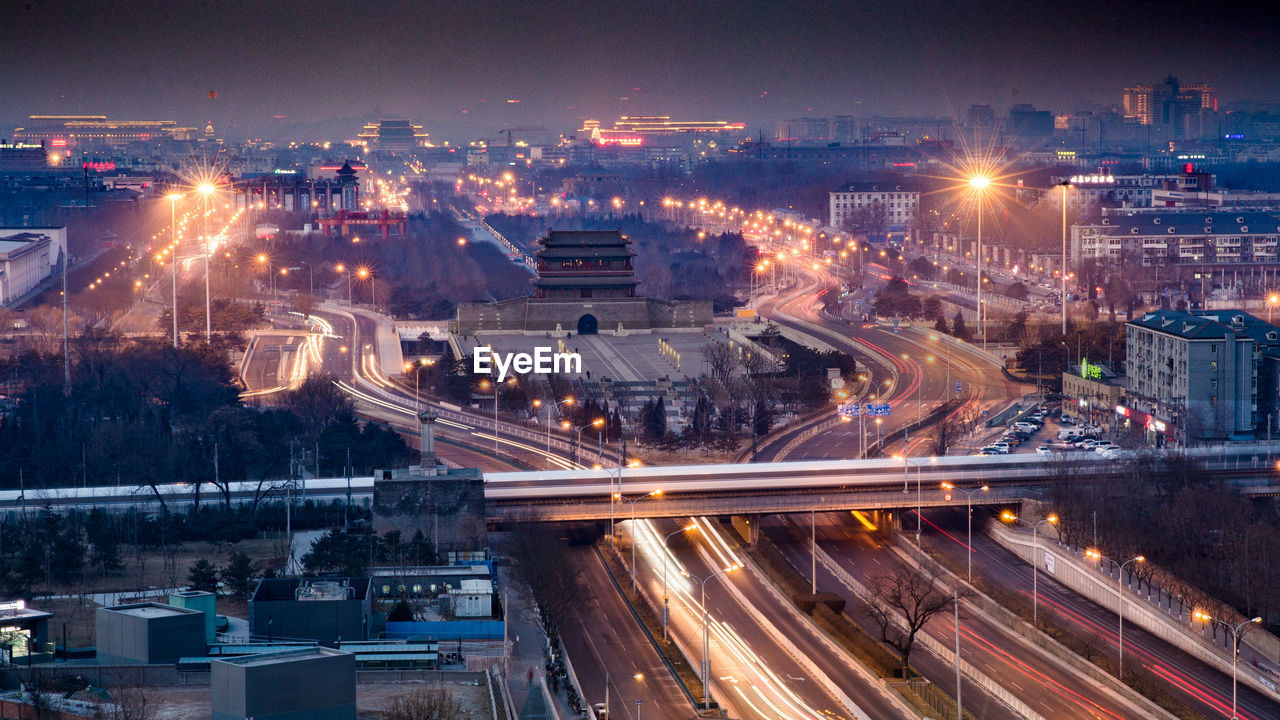 High angle view of light trails on city street at night