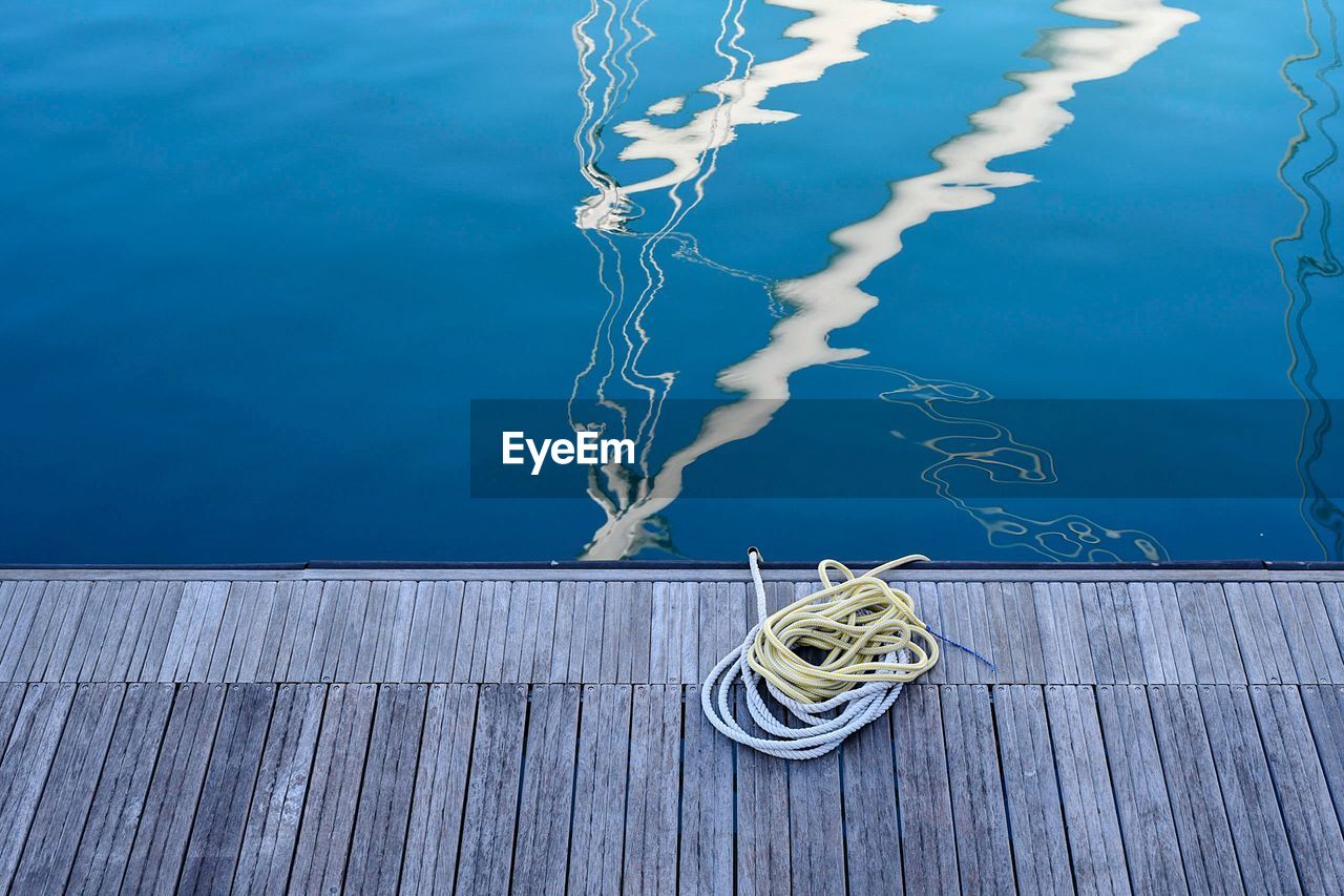 Nautical ropes on a wooden dock of the port
