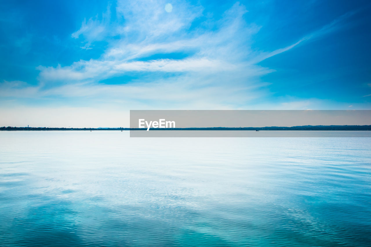 Scenic view of sea against blue sky