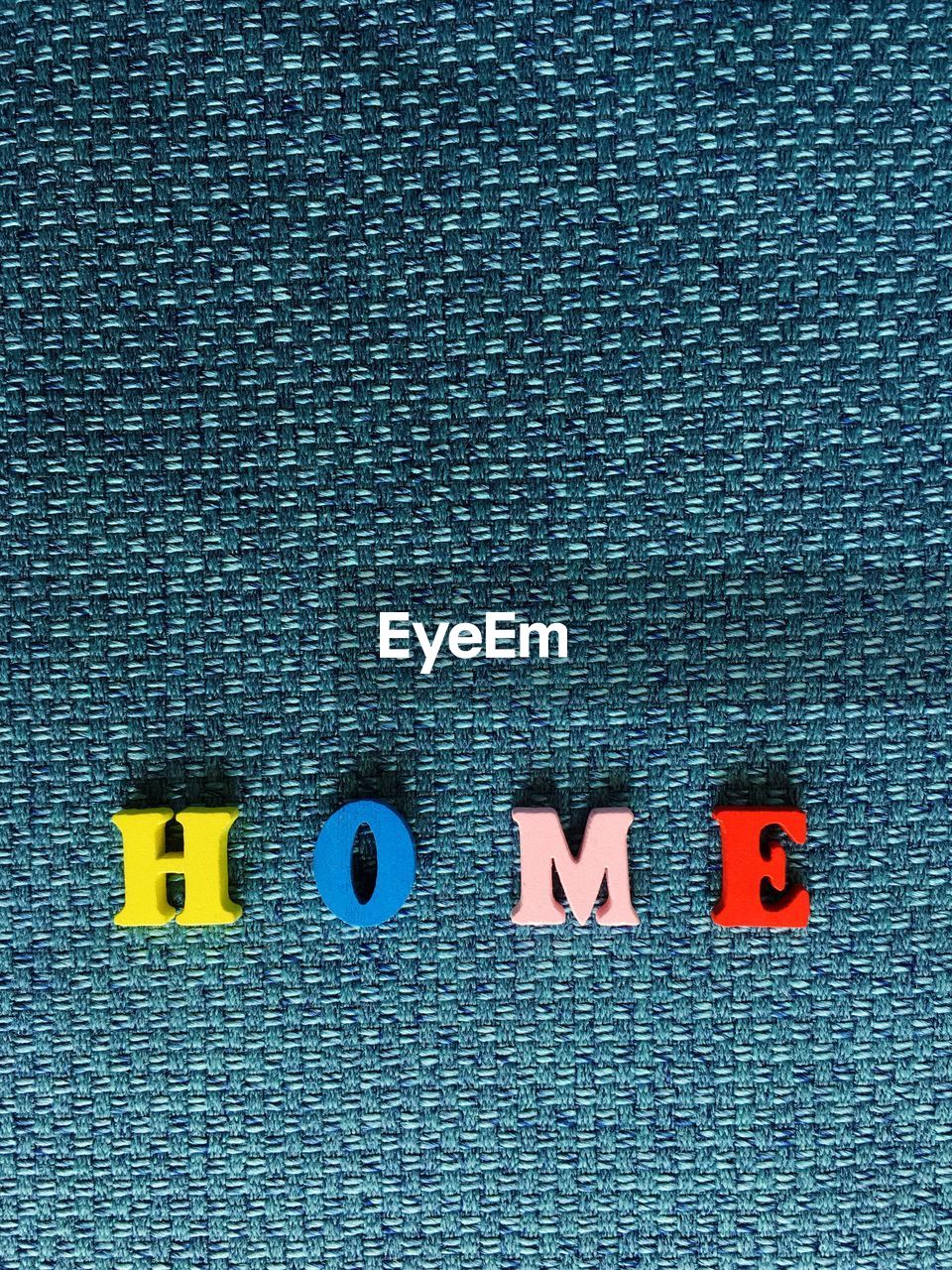 Text made with toy blocks on fabric