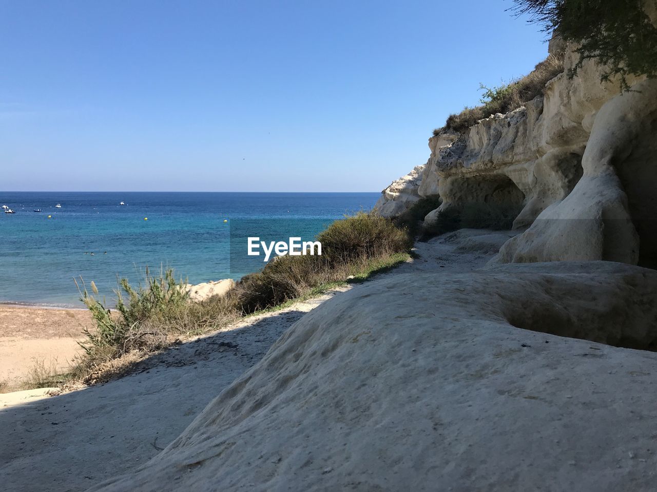 Scenic view of sea against clear sky