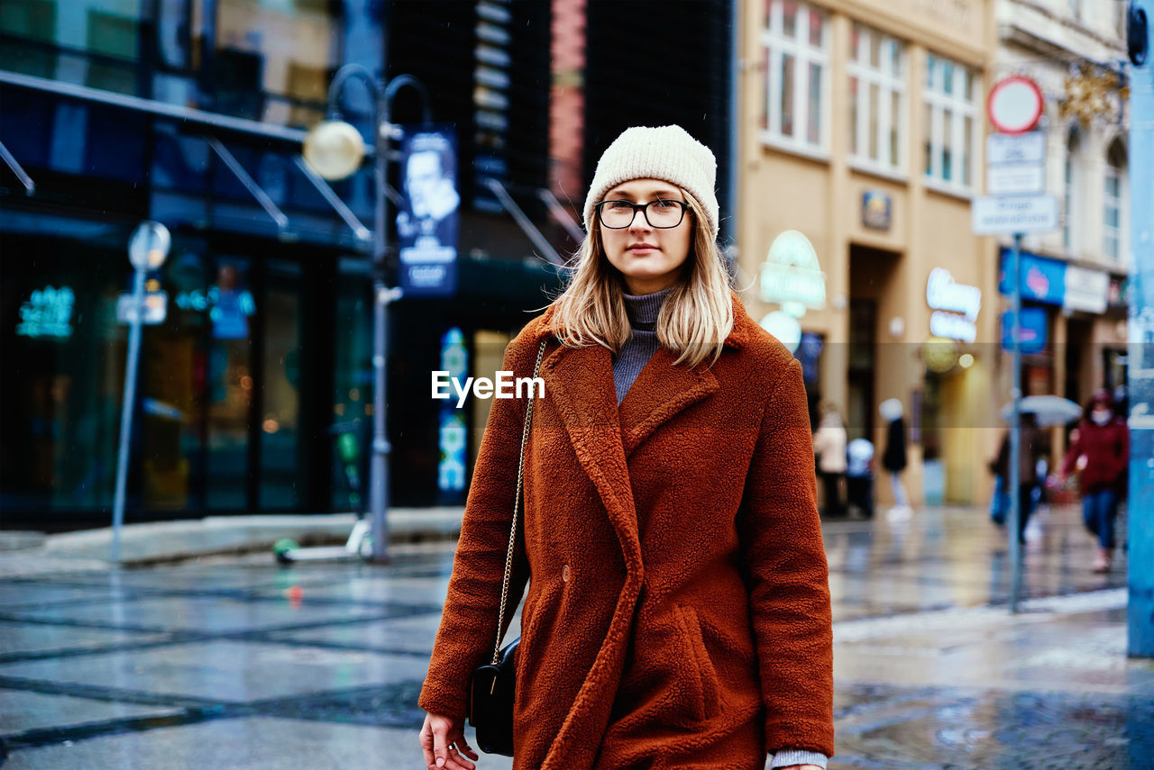 Woman walking at city street