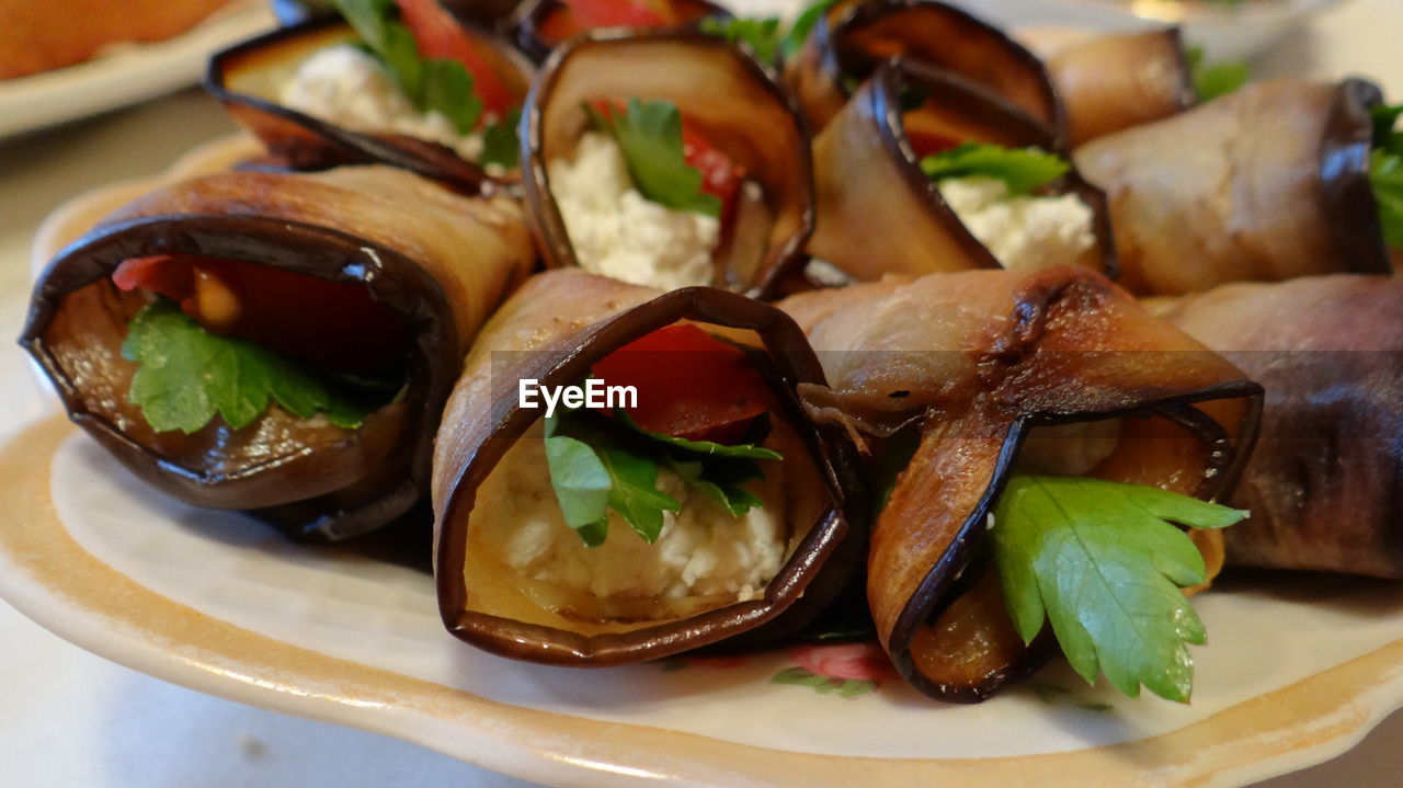 Close-up of eggplant rolls on plate