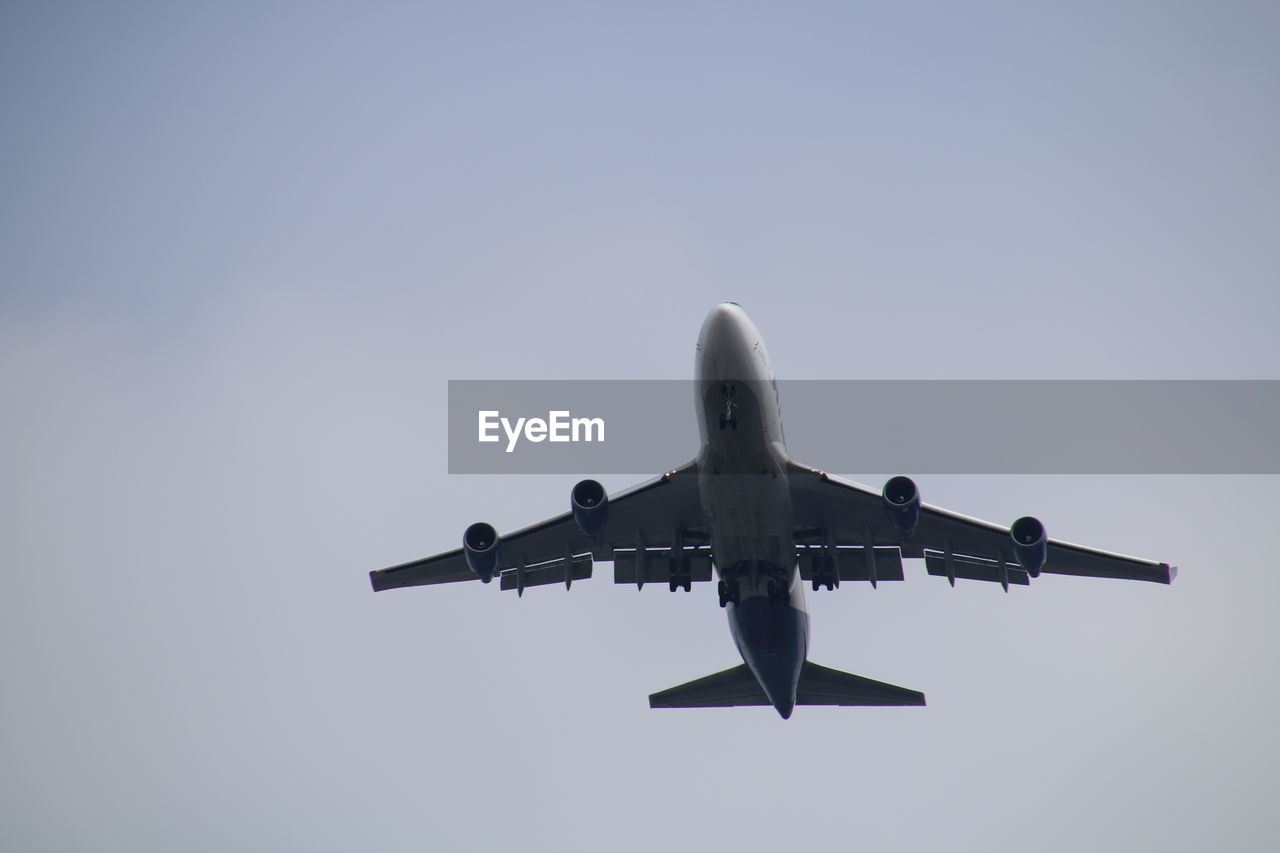 Low angle view of airplane flying in sky