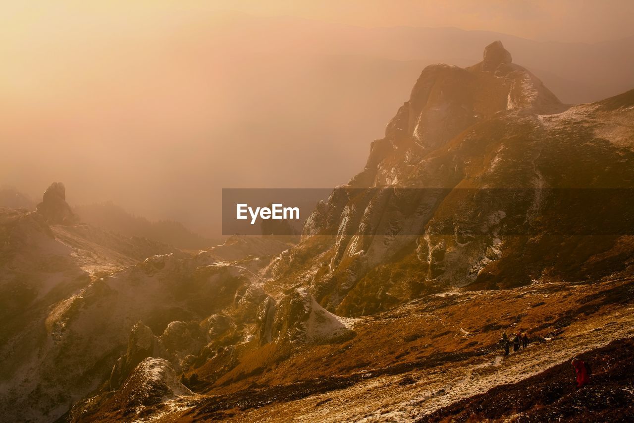 Aerial view of mountain against sky during sunset