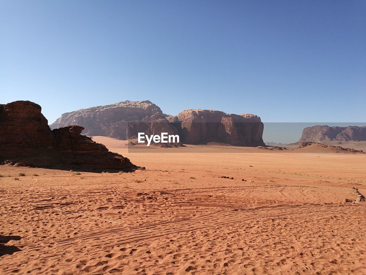 Scenic view of desert against clear sky