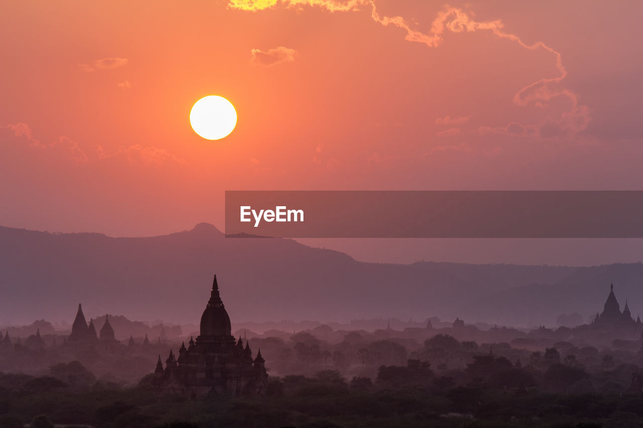Silhouette of temple against sky during sunset