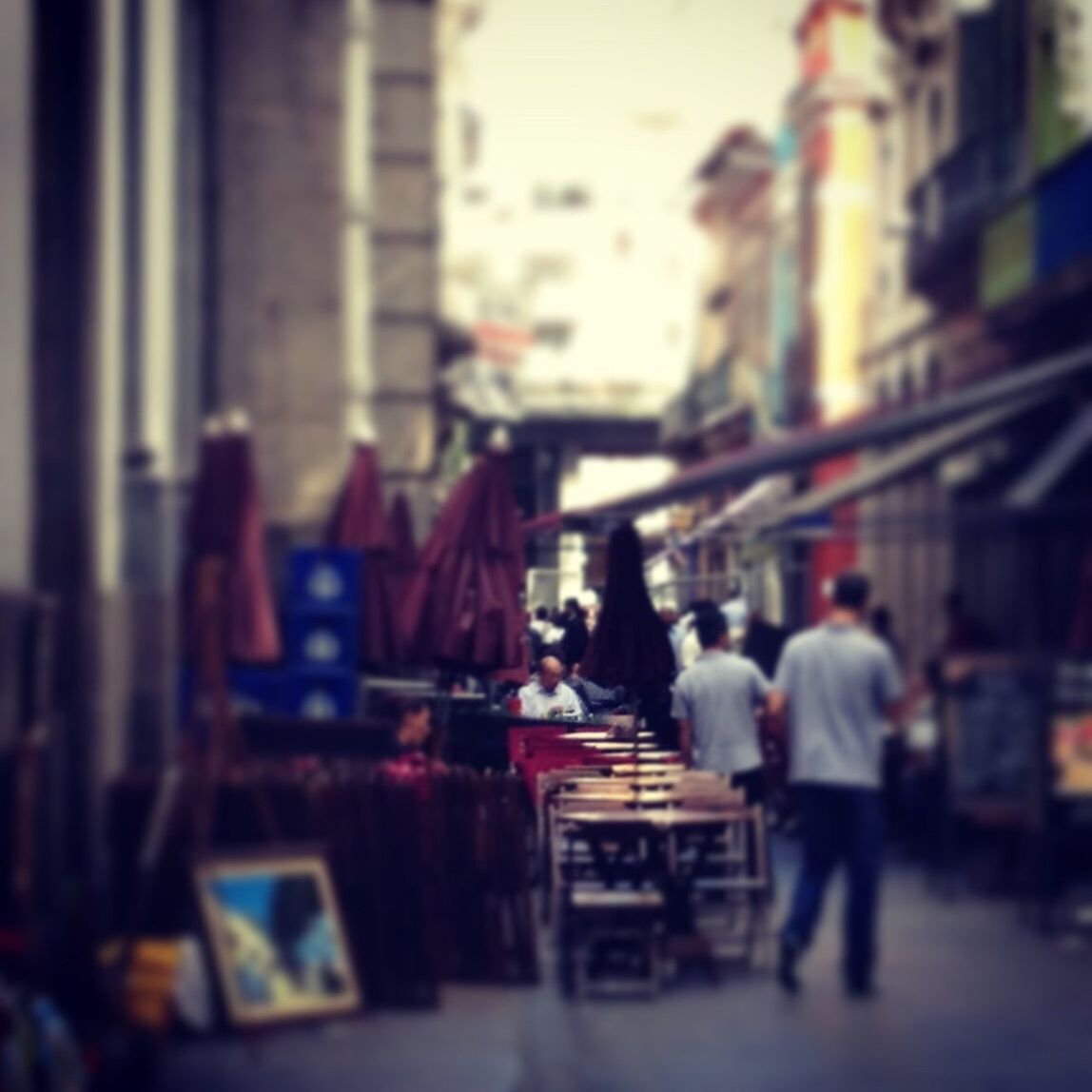 REAR VIEW OF PEOPLE SITTING ON TABLE