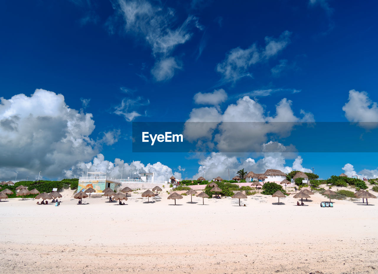 Panoramic view of beach against blue sky