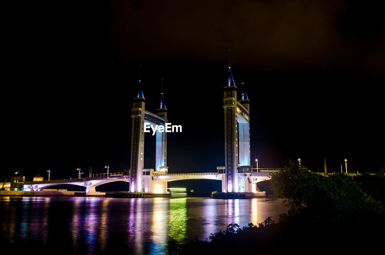 ILLUMINATED BRIDGE AT NIGHT