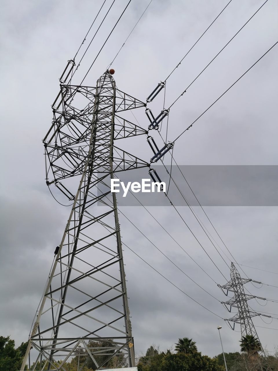 LOW ANGLE VIEW OF ELECTRICITY PYLON