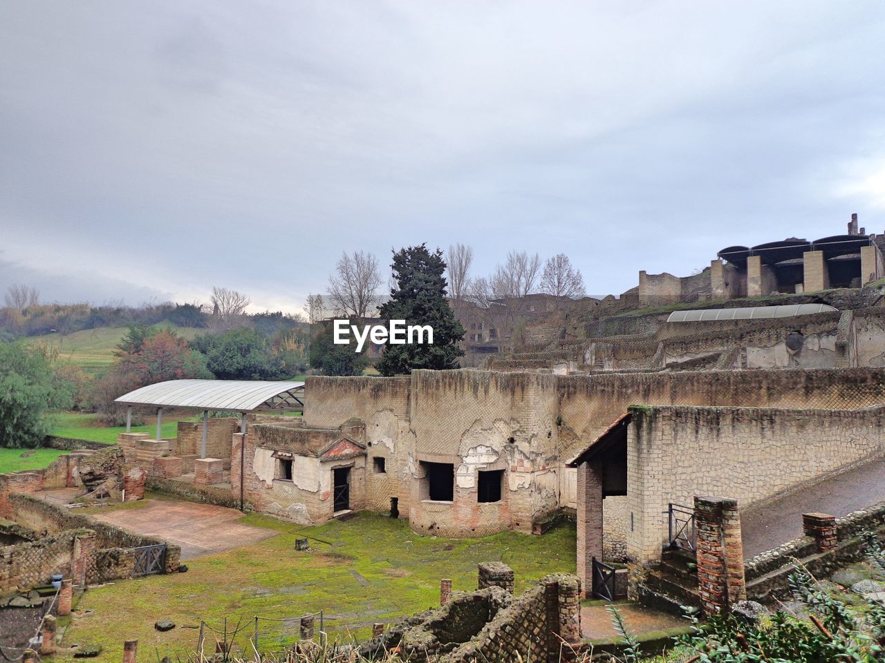 OLD BUILDINGS AGAINST SKY