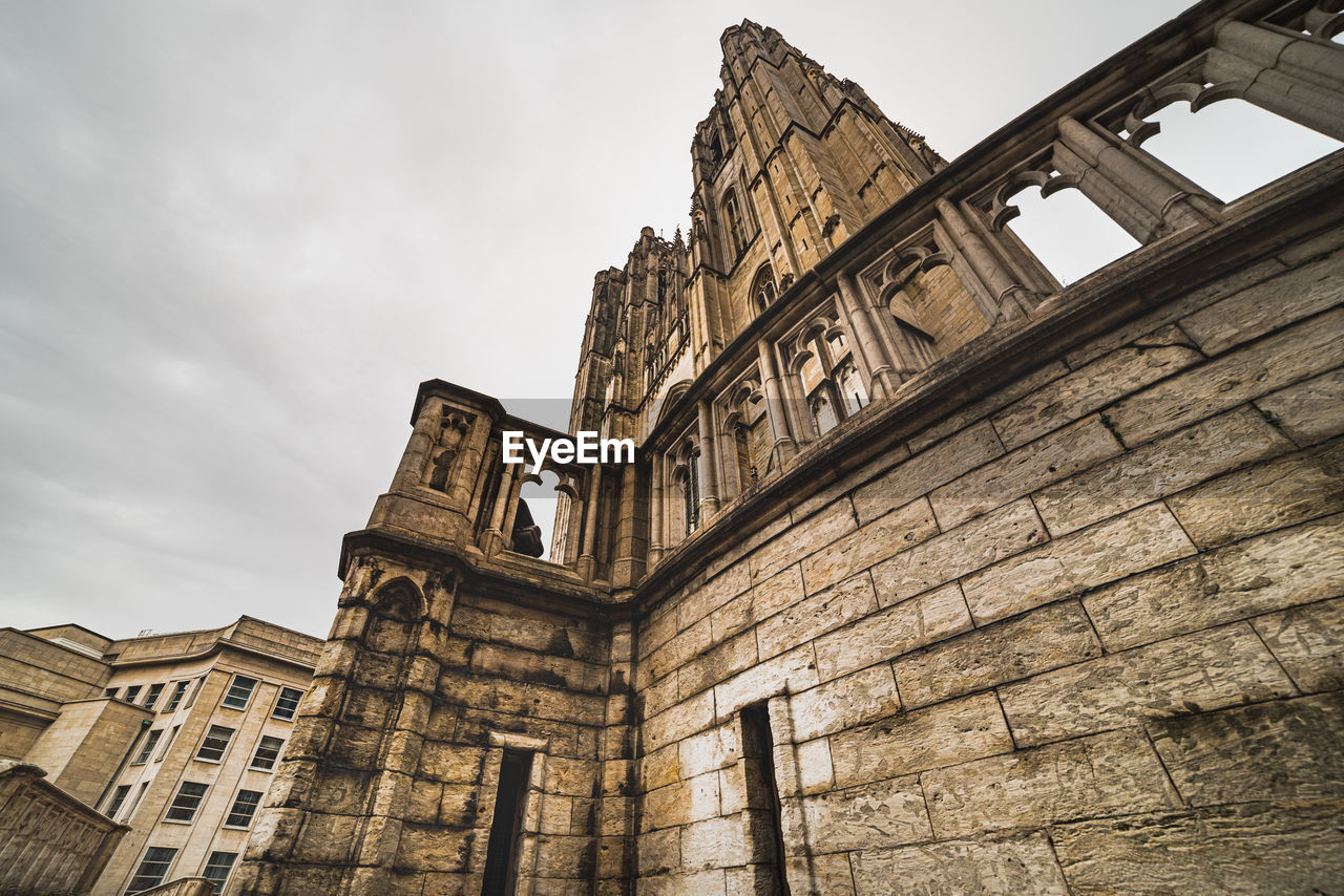 LOW ANGLE VIEW OF OLD CATHEDRAL AGAINST SKY