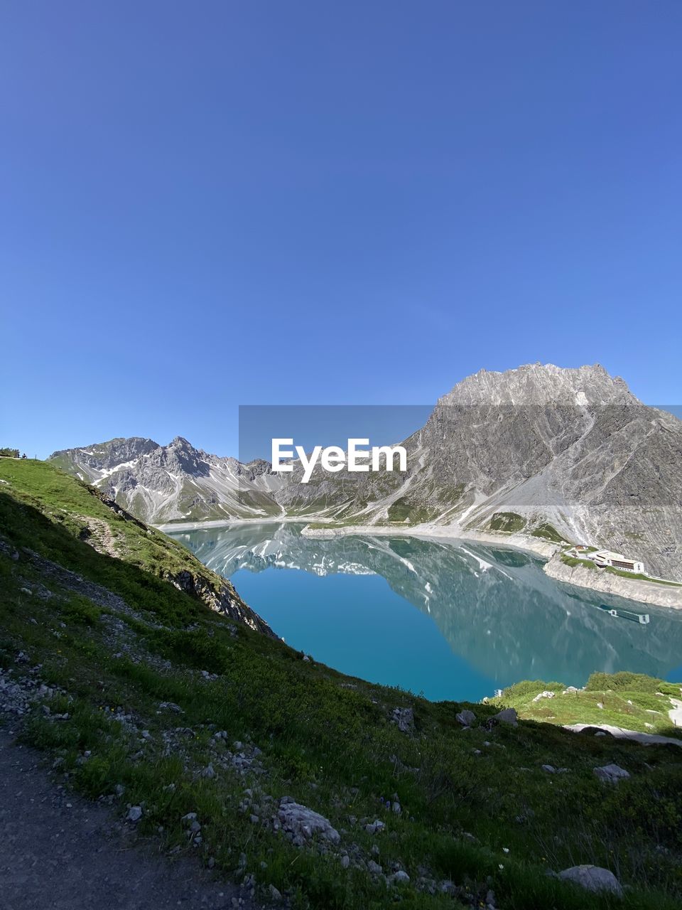 Scenic view of sea against clear blue sky